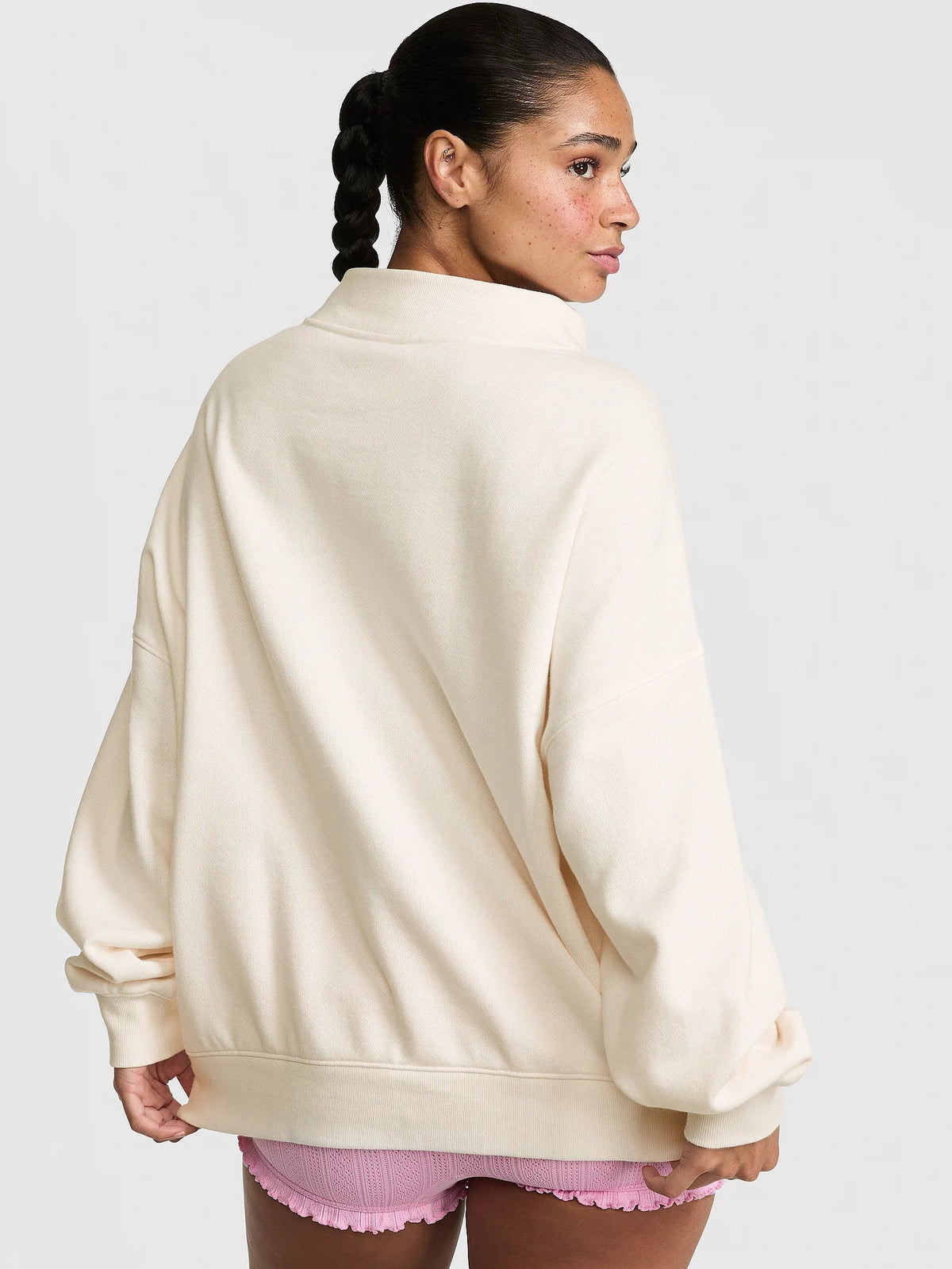 Mock-neck collar detail on the oversized sweatshirt.