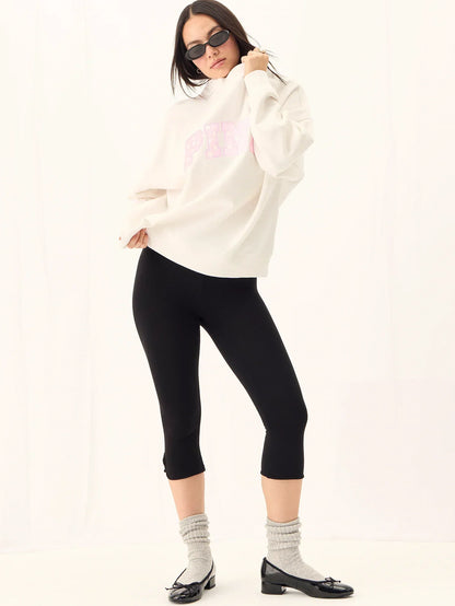 Blush pink polka-dot fill on the varsity-style graphic.